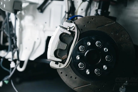Close-up of a car's brake rotor and caliper