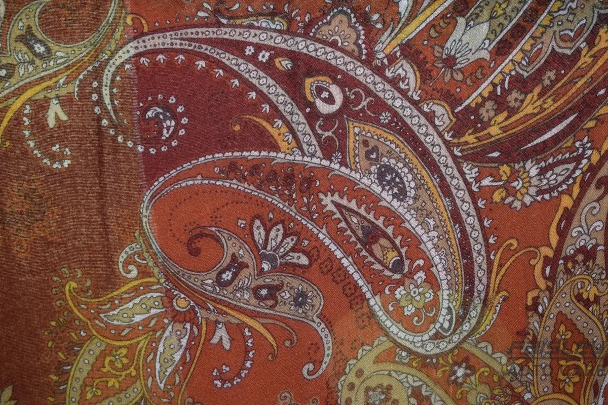 Close-up of a paisley pattern with warm colors