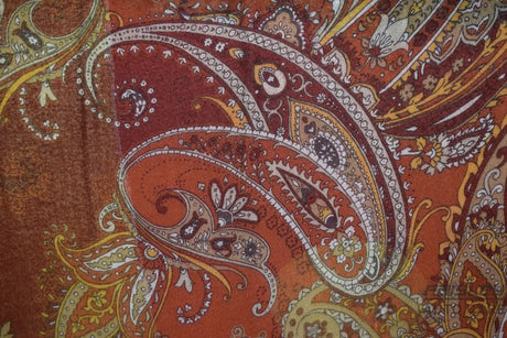 Close-up of a paisley pattern with warm colors
