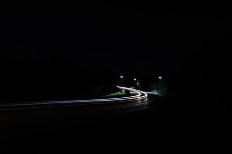time-lapse photography of moving vehicles on road